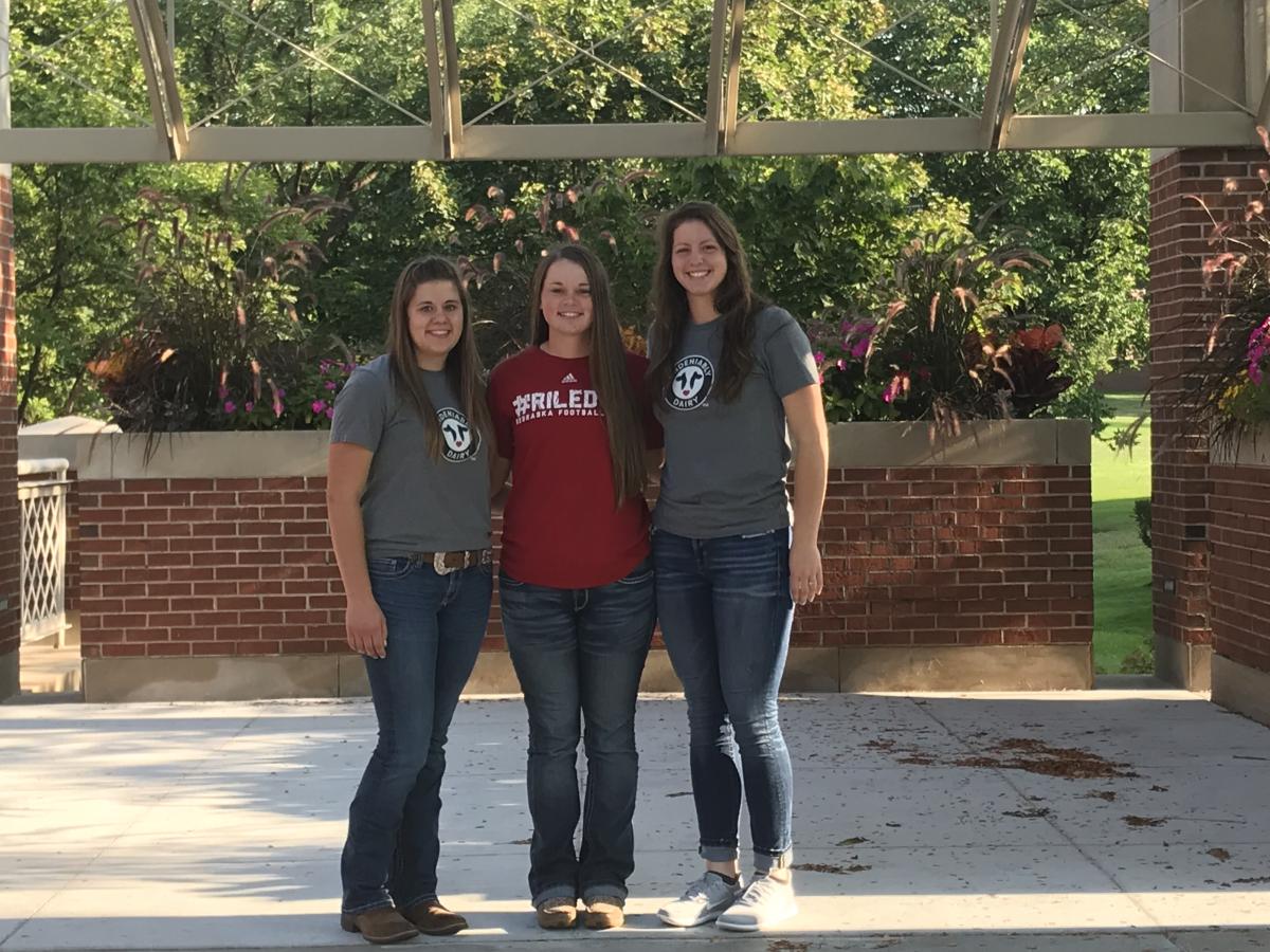Jessi sayers, bailey peterson, and dawn klabenes dairy ambassadors posed for a picture while on the agribusiness tours in August